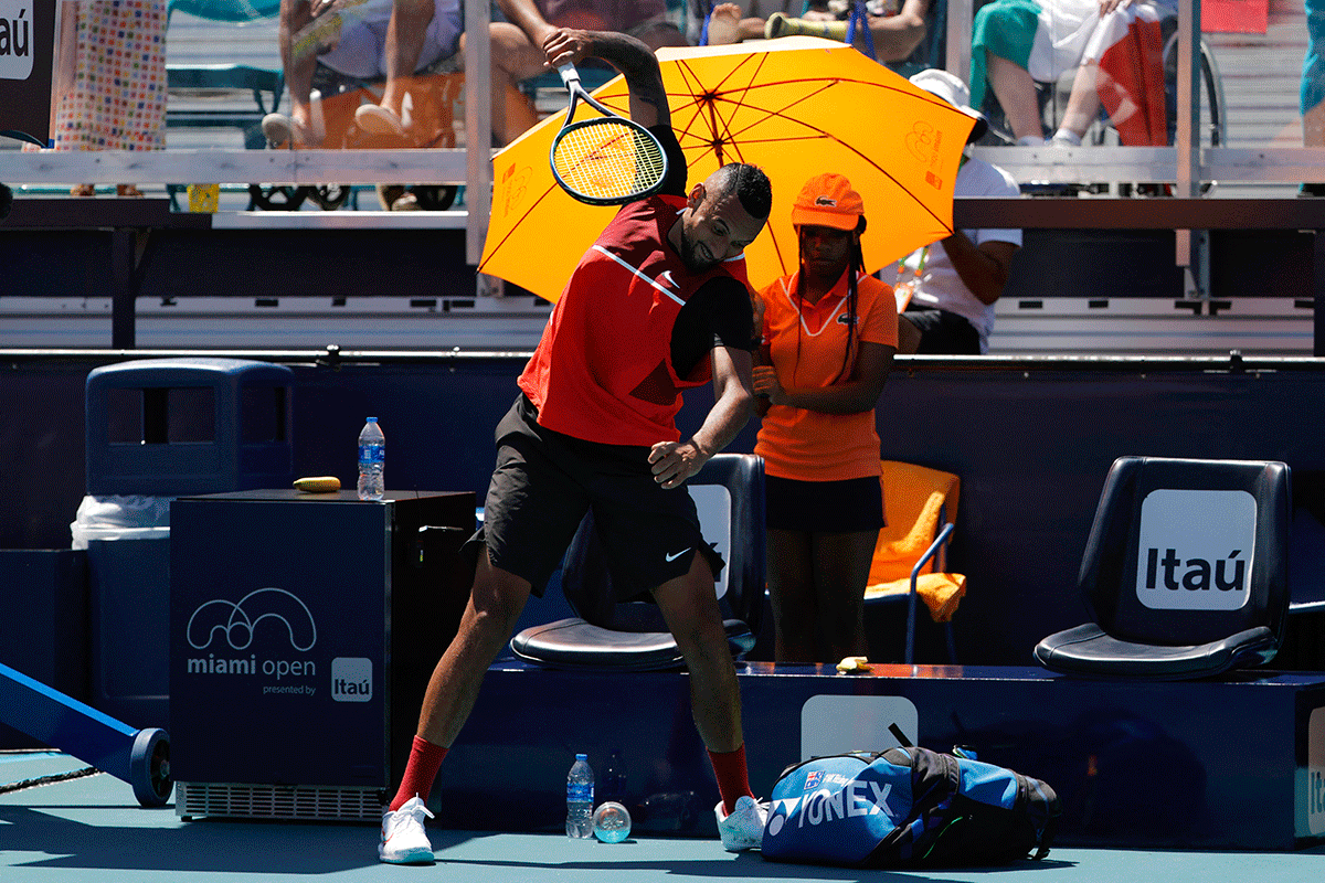 Australia's Nick Kyrgios smashes his racquet at the end of the first set after being assessed a point penalty against Italy's Jannik Sinner in a fourth round men's singles match in the Miami Open at Hard Rock Stadium in Miami Gardens in Miami, Florida, on Tuesday.