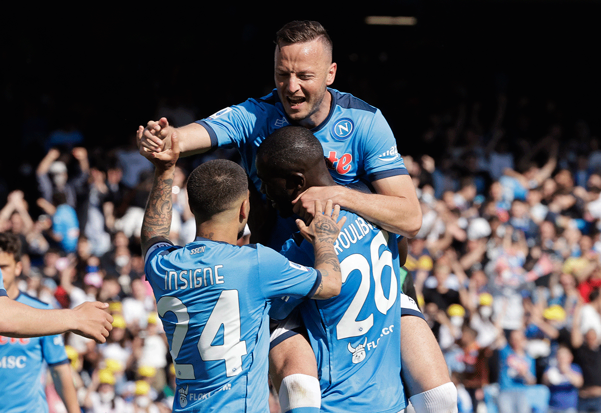 Napoli's Amir Rrahmanis celebrates scoring their sixth goal with teammates during the match against U.S. Sassuolo at Stadio Diego Armando Maradona, Naples, Italy