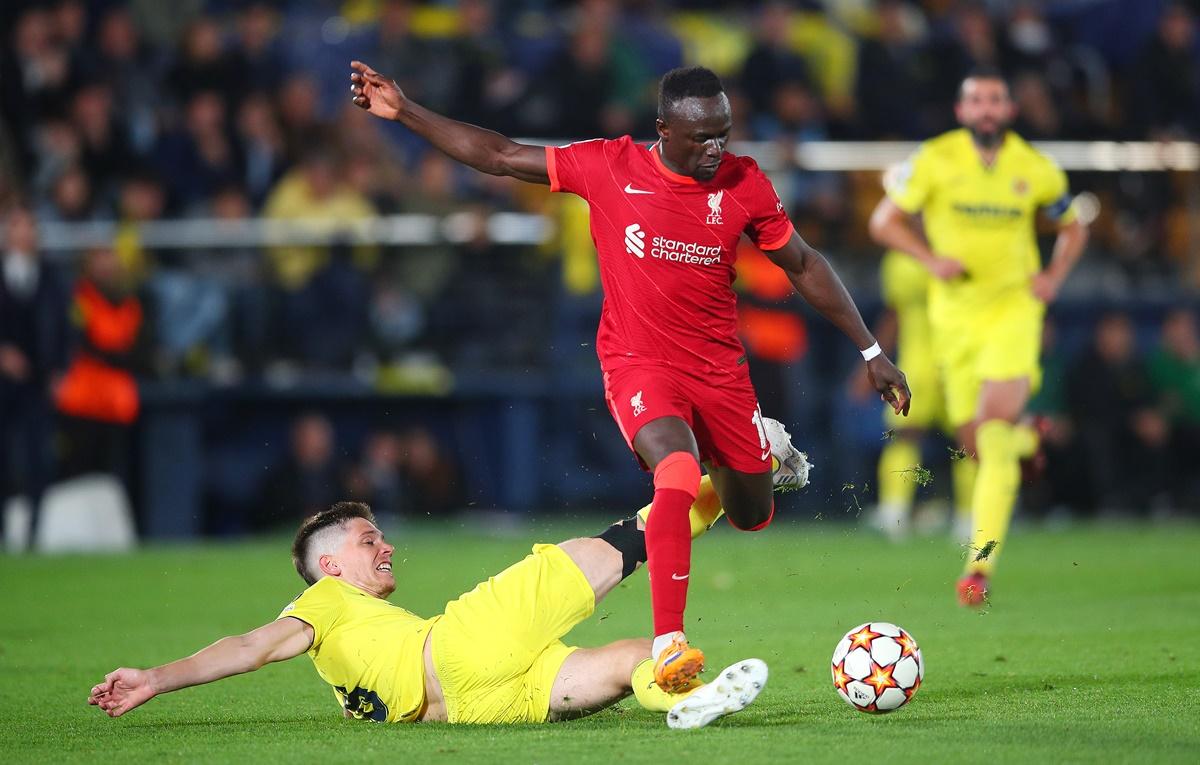 Sadio Mane evades a tackle from Juan Foyth before scoring Liverpool's third goal during the UEFA Champions League semi-final second leg against Villarreal at Estadio de la Ceramica on Tuesday. 