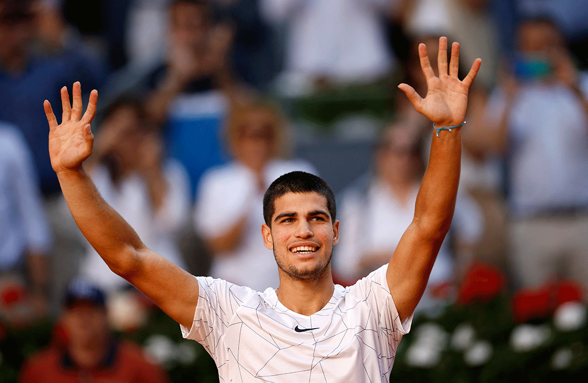 Spain's Carlos Alcaraz Garfia celebrates winning his Madrid Open quarter-final against compatriot Rafael Nadal at Caja Magica, Madrid, Spain, on Friday 