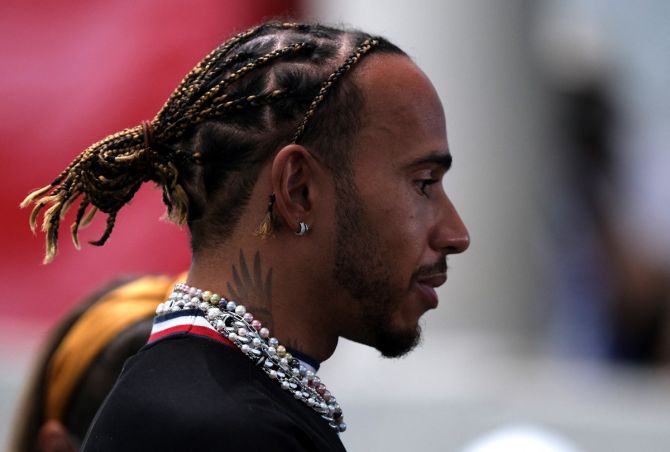 Lewis Hamilton also had strings of thick necklaces and studs in both ears