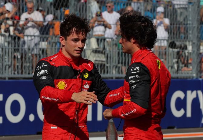 Ferrari's Charles Leclerc and Carlos Sainz Jr. embrace after qualifying in a front row lockout.