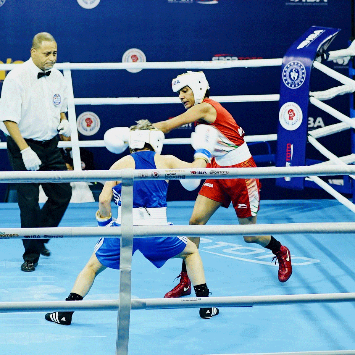 India's Nitu lands a punch on Steluta Duta during her first match at the World Boxing Championships in Istanbul on Tuesday