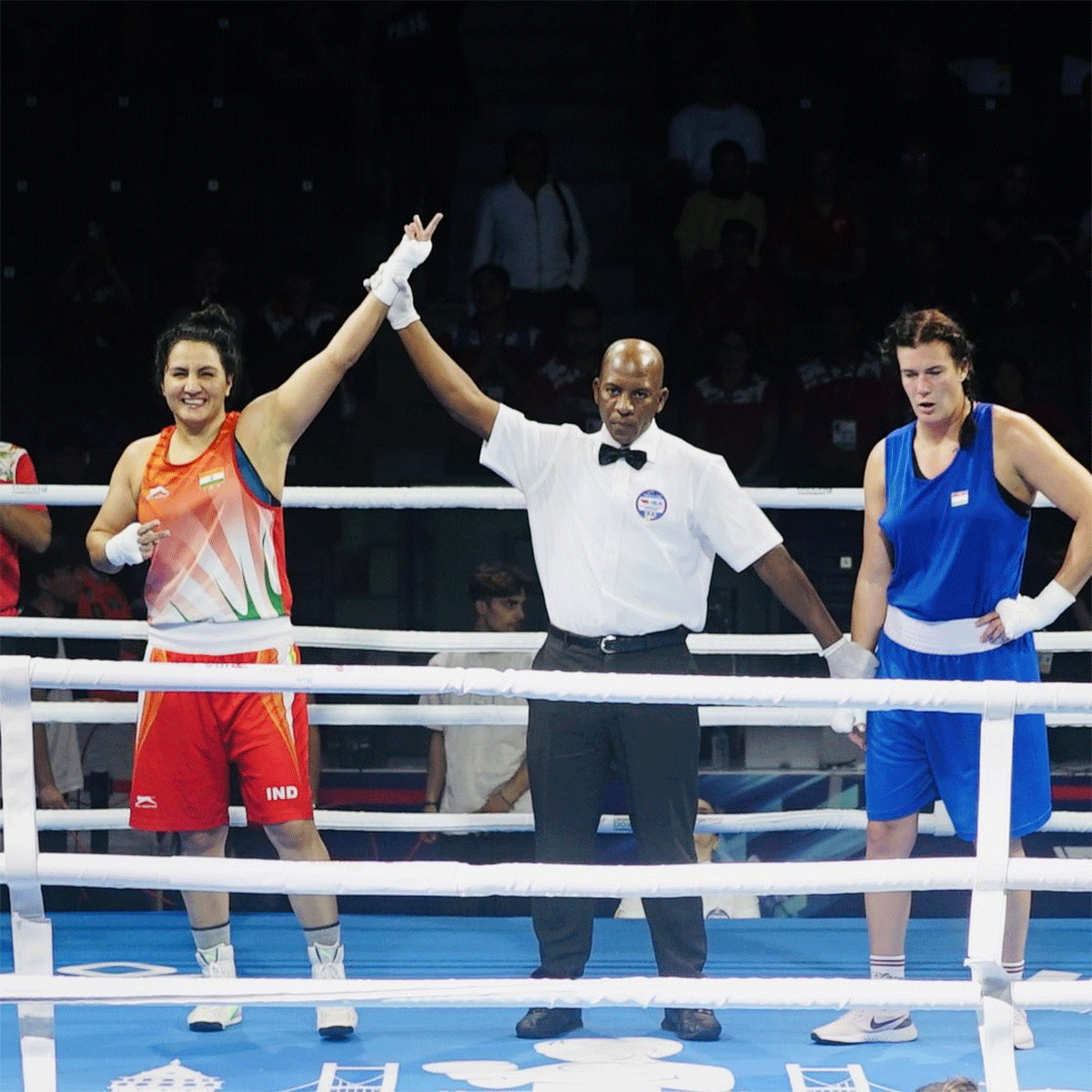 Pooja Rani celebrates on winning her 81kg bout to move into the quarter-final on Friday.