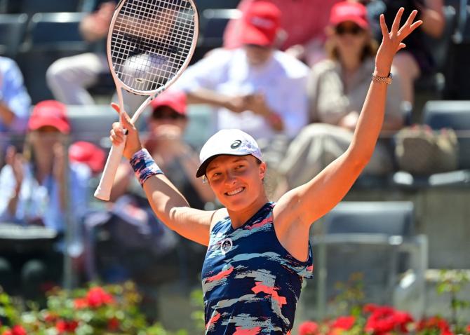 Poland's Iga Swiatek celebrates victory over Belarus's Aryna Sabalenka in the semi-finals.