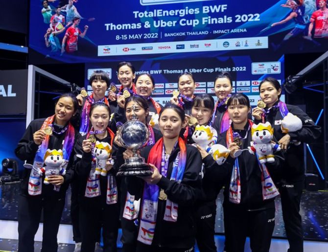 South Korea's players celebrate with the Uber Cup after defeating China in a tense final in Bangkok on Saturday.