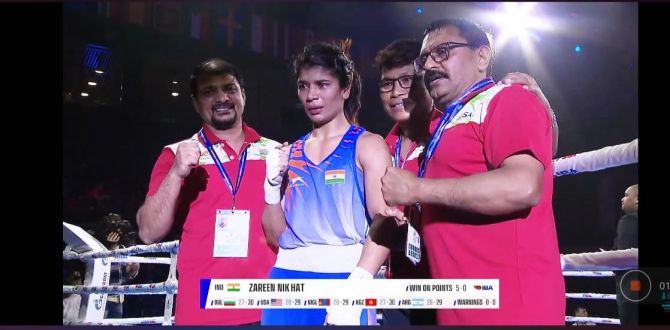 Nikhat Zareen is surrounded by her support staff and coach after clinching the gold. 