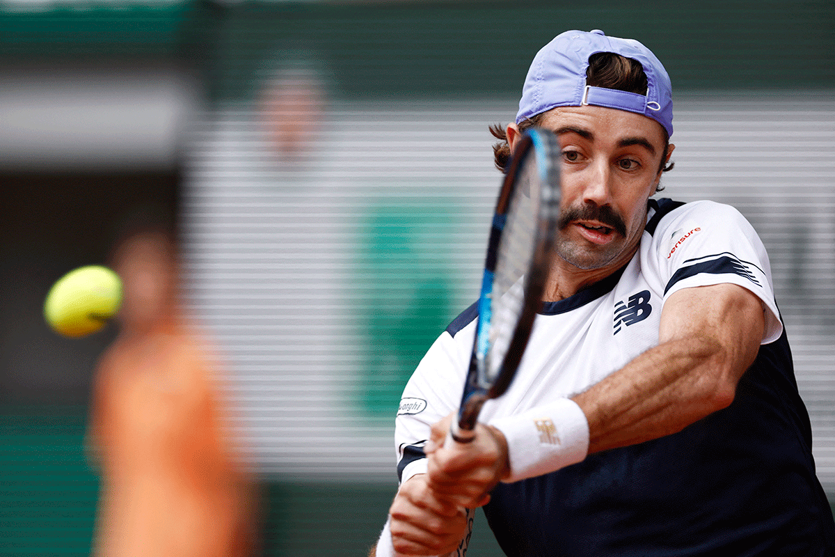 Australia's Jordan Thompson in action against Spain's Rafael Nadal