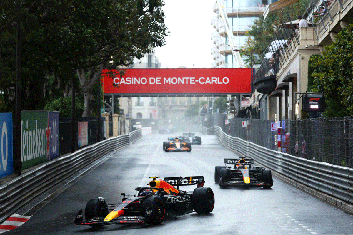Sergio Perez driving the (11) Oracle Red Bull Racing RB18 leads Max Verstappen driving the (1) Oracle Red Bull Racing RB18 on a formation lap in the rain