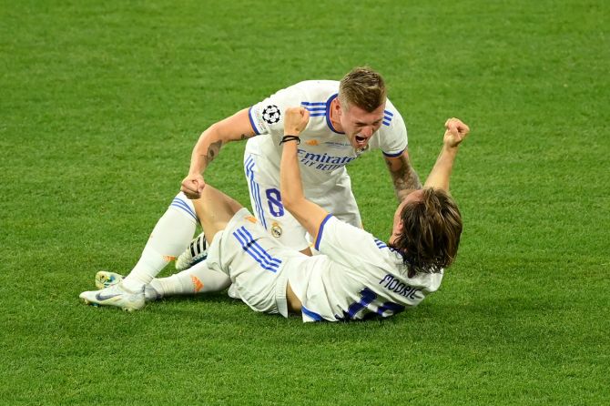 Toni Kroos and Luka Modric break into celebration after victory is clinched.