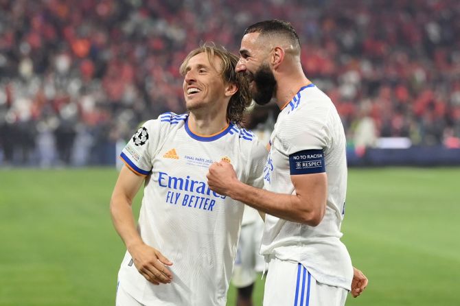 Real Madrid stars Luka Modric and Karim Benzema celebrate victory.