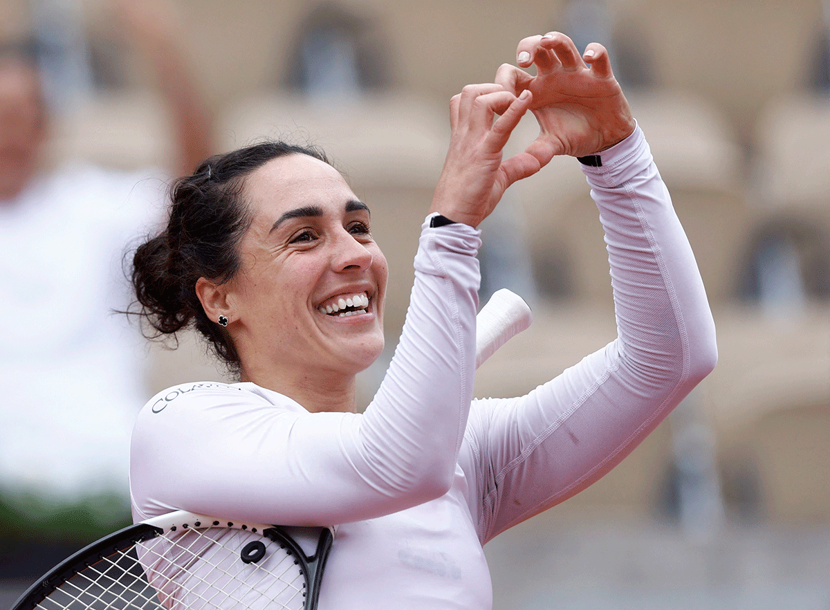 Italy's Martina Trevisan celebrates winning her fourth round match against Belarus' Aliaksandra Sasnovich 