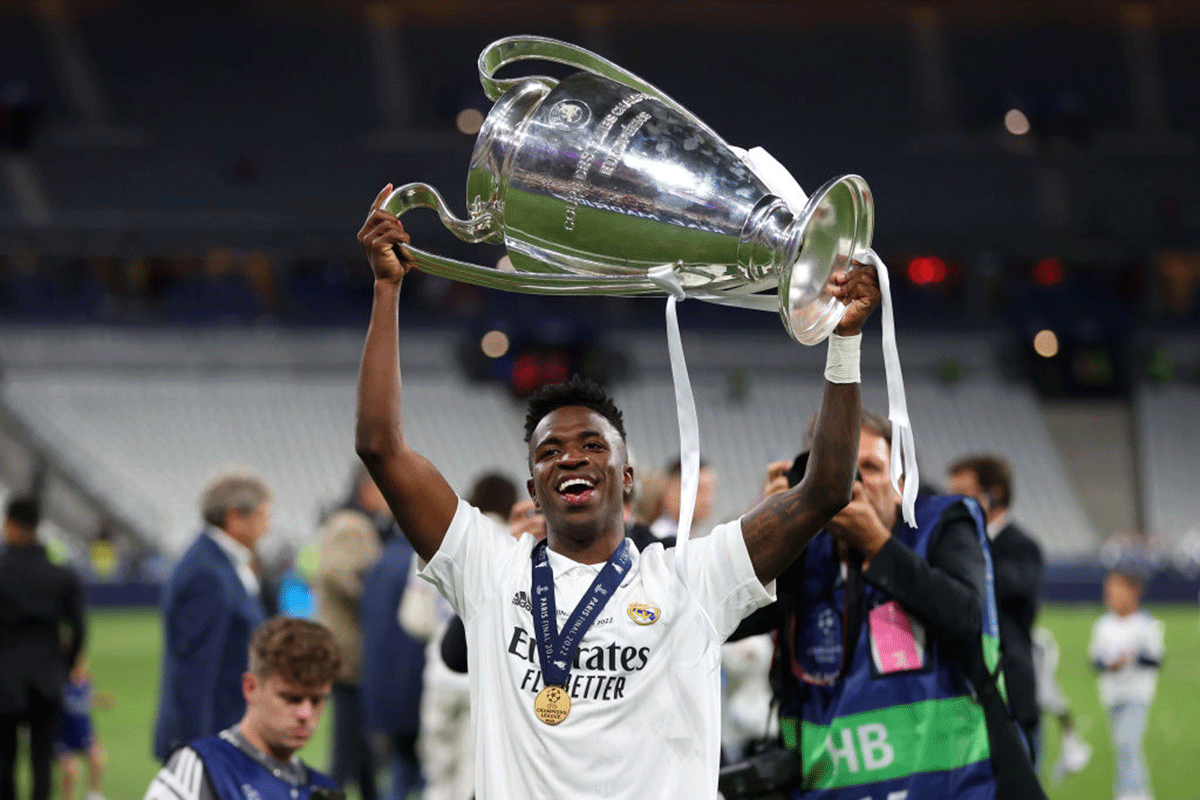 Vinicius Junior celebrates with the UEFA Champions League Trophy after the victory on Saturday