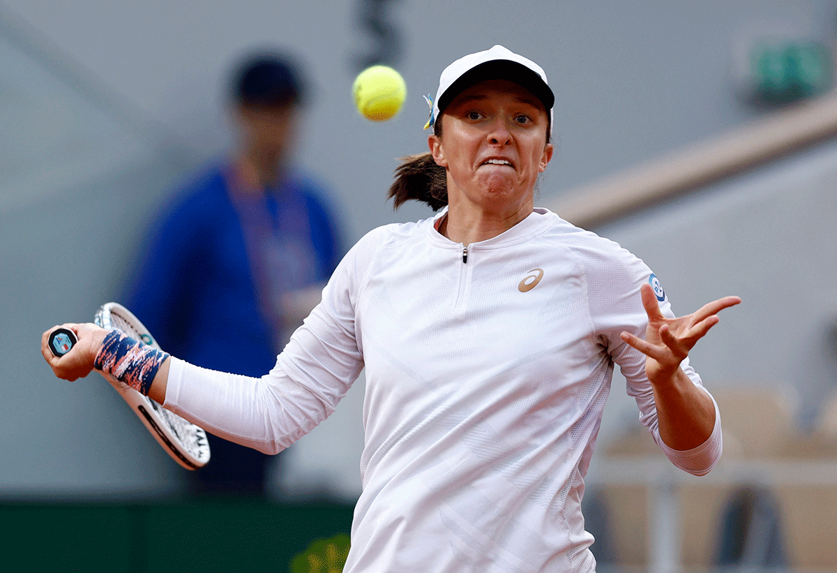 Poland's Iga Swiatek in action during her fourth round match against China's Qinwen Zheng