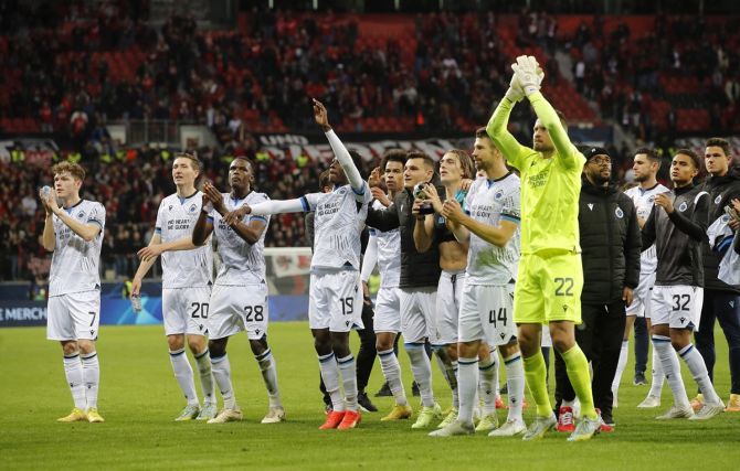 Club Brugge's players acknowledge fans after the Champions League Group B match against Bayer Leverkusen, at BayArena, Leverkusen, Germany.