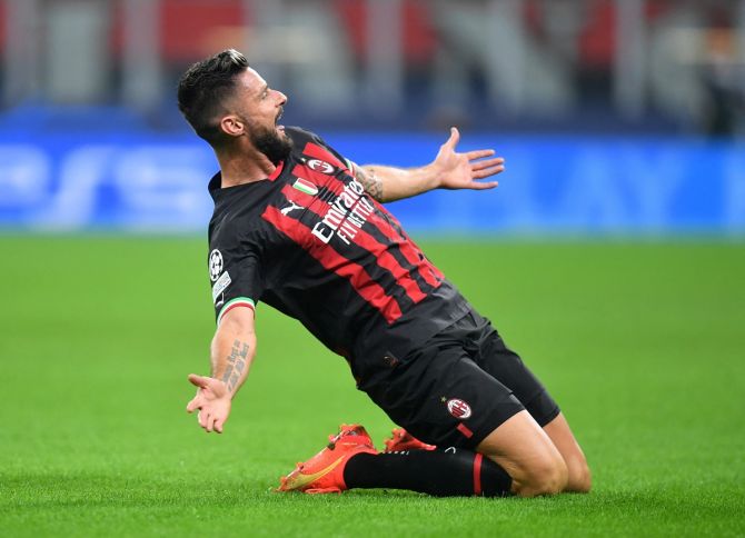 Olivier Giroud celebrates putting AC Milan ahead during the Champions League Group E match against FC Salzburg, at San Siro, Milan, Italy, on Wednesday.