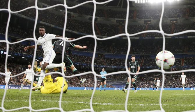 Vinicius Junior scores Real Madrid's fourth goal during the  Champions League Group F match against Celtic, at Santiago Bernabeu, Madrid.