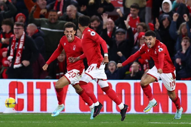 Morgan Gibbs-White celebrates scoring Nottingham Forest's second goal with Brennan Johnson and Jesse Lingard during the match against BrentFord.