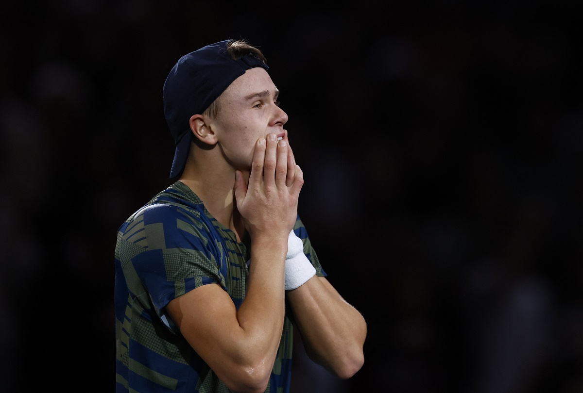 Holger Rune reacts after clinching victory.