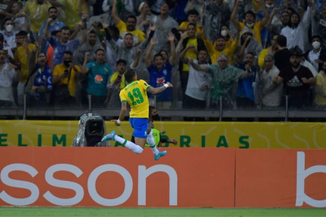 Raphinha of Brazil celebrates after scoring the opening goal during a match between Brazil and Paraguay