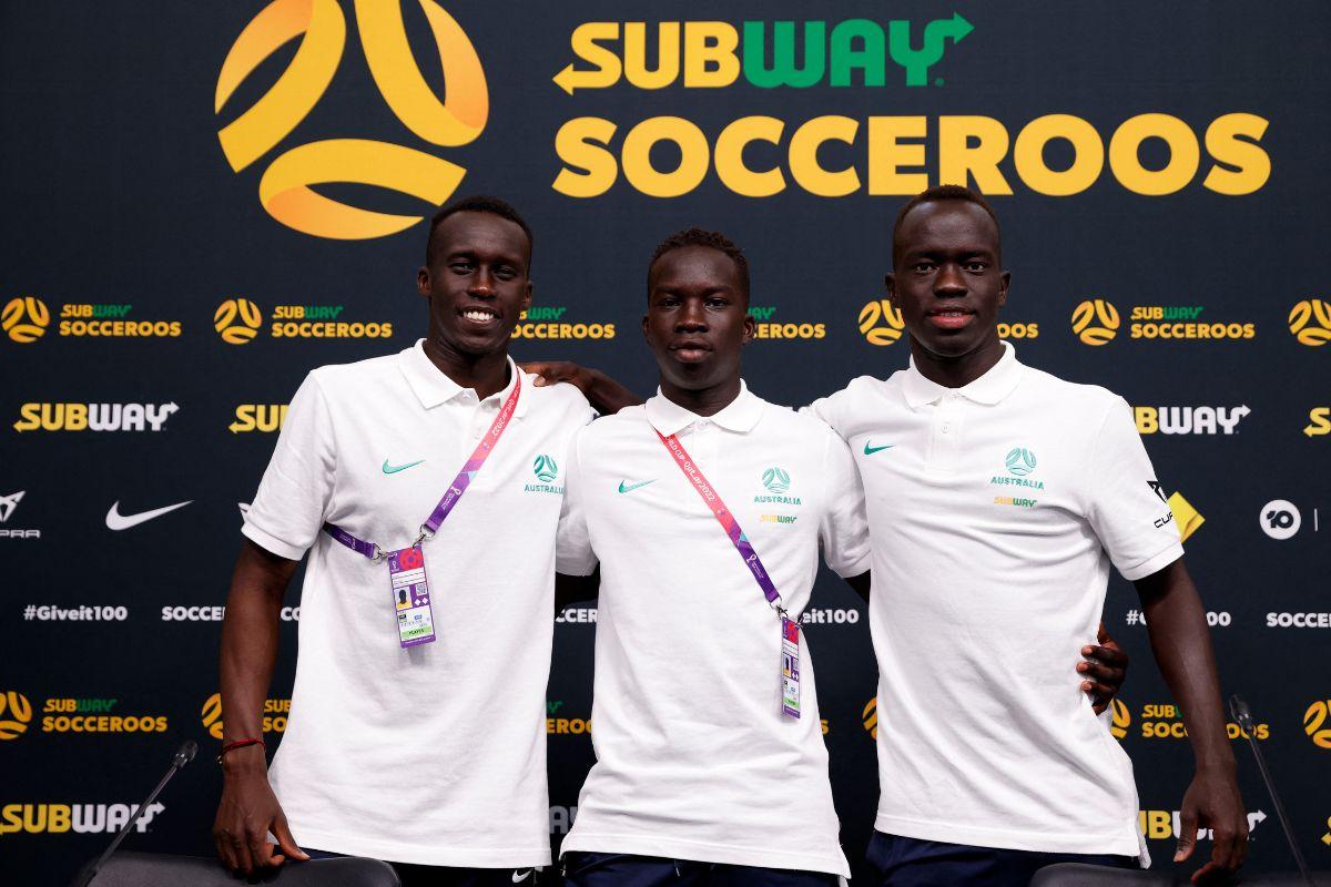 Australia's Thomas Deng, Garang Kuol and Awer Mabil pose for a photo.