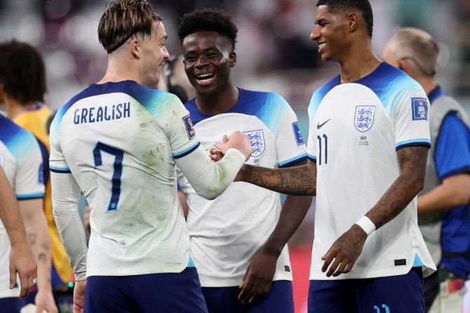 England's Jack Grealish, Bukayo Saka and Marcus Rashford celebrate after the match