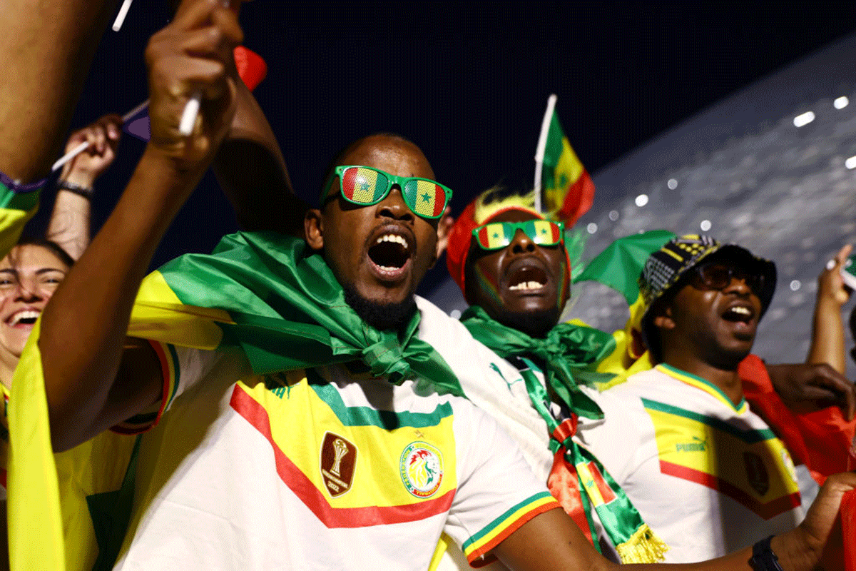 A Senegal fan enjoys the pre match atmosphere