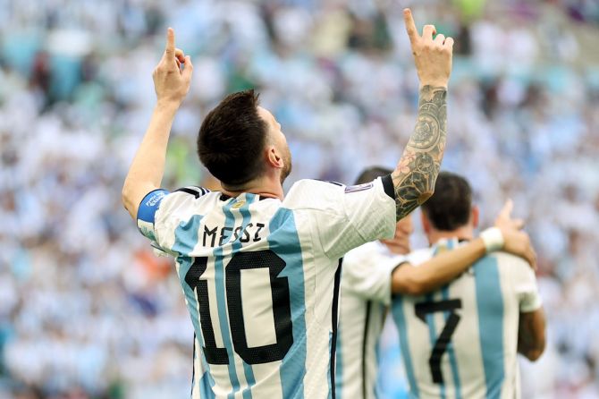 Lionel Messi celebrates after scoring Argentina's first goal from the penalty spot
