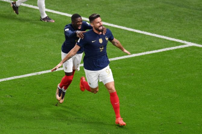 France's Olivier Giroud celebrates with Ousmane Dembele after scoring their team's second goal.