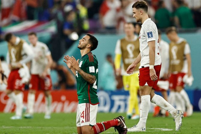 Mexico's Luis Chavez and Poland's Matty Cash react after the match