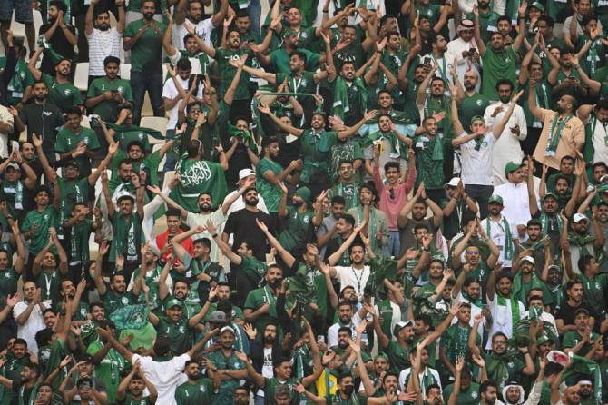 A Saudi Arabia fan celebrates their team's 2-1 victory in the FIFA World Cup Qatar 2022 Group C match between Argentina and Saudi Arabia at Lusail Stadium.