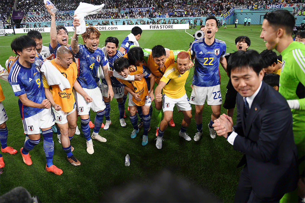 Japan players and staff celebrate