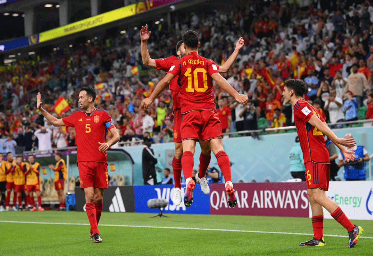 Spain's Dani Olmo celebrates with teammates after scoring their team's first goal