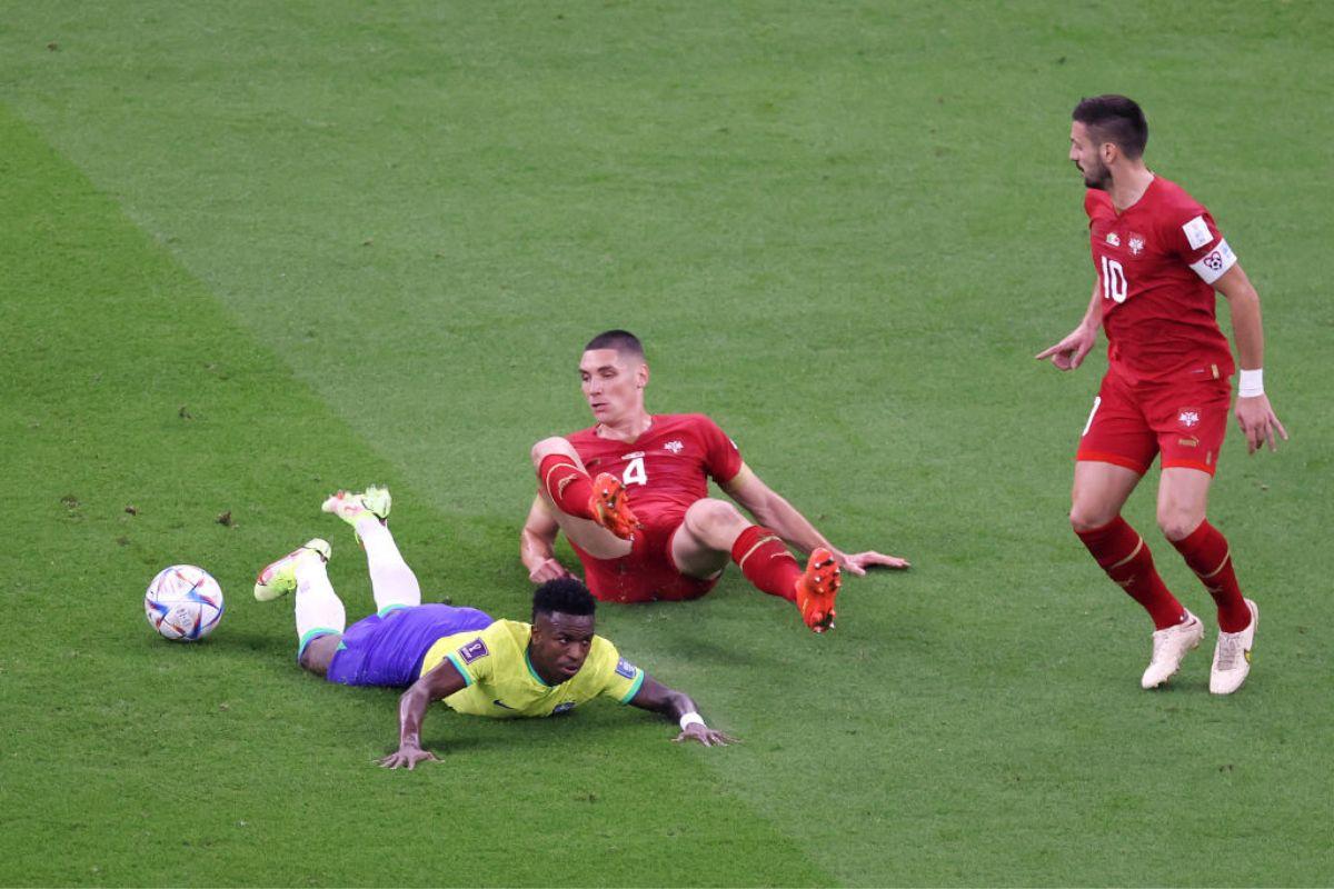 Vinicius Junior of Brazil is fouled by Nikola Milenkovic of Serbia 