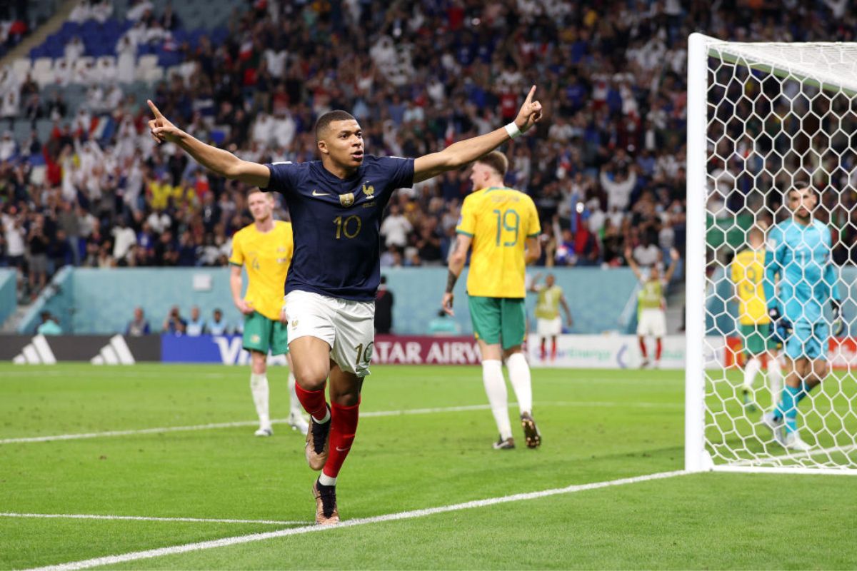 Kylian Mbappe celebrates after scoring Frances' third goal past Harry Souttar of Australia