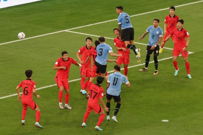 Uruguay's Diego Godin heads at goal