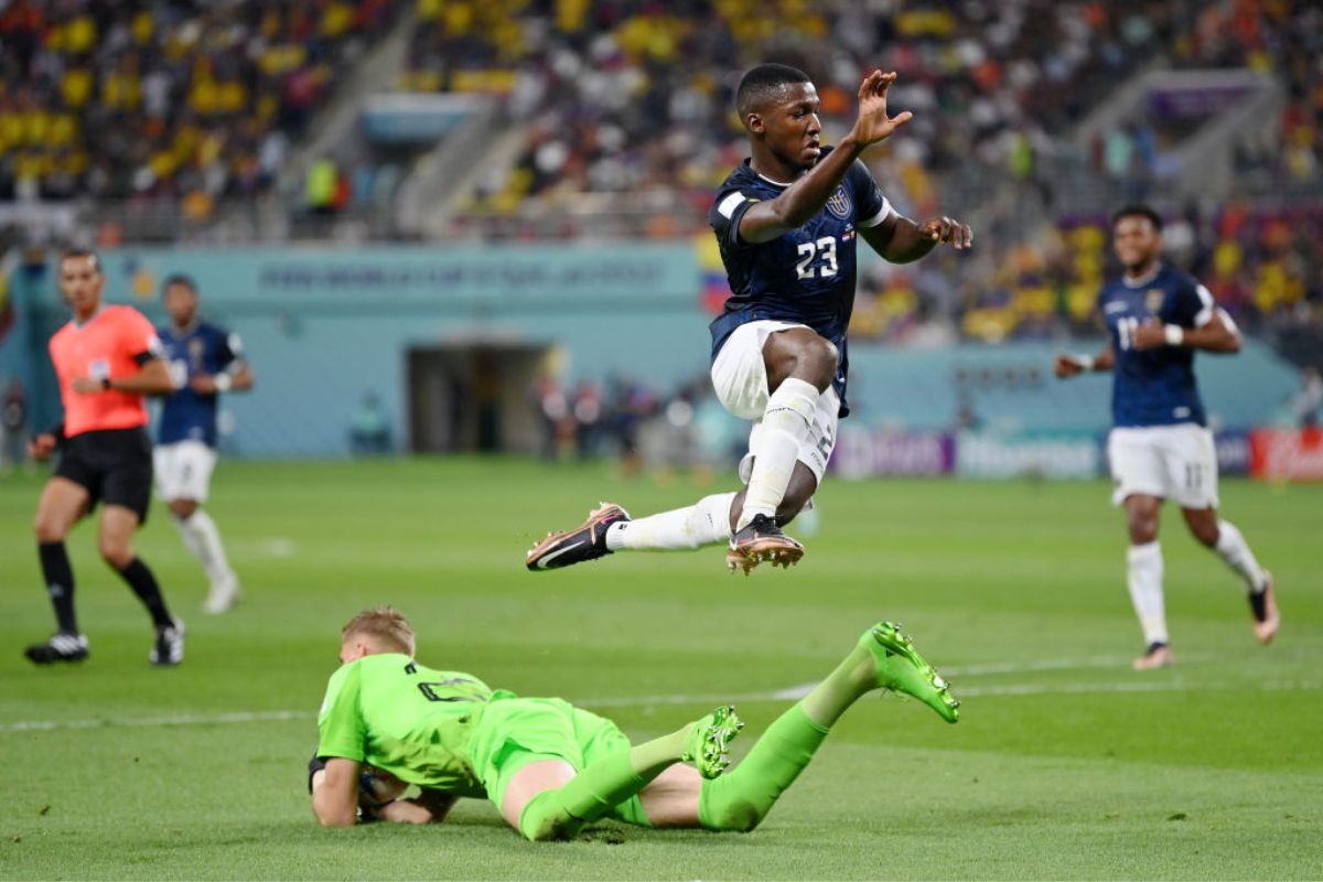 Moises Caicedo of Ecuador leaps as Andries Noppert of Netherlands makes a save