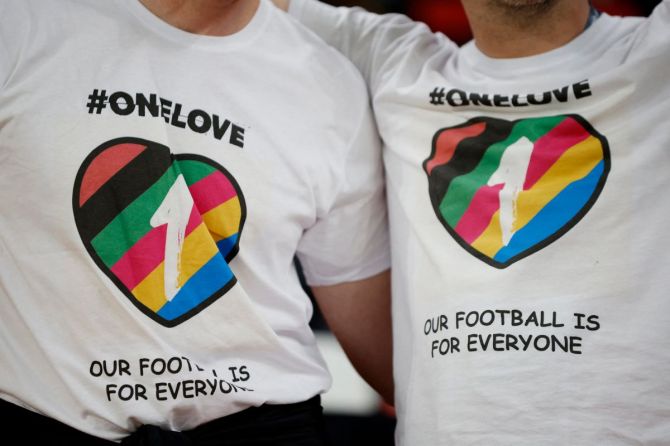 Belgium fans wear OneLove t-shirts inside the stadium before the match