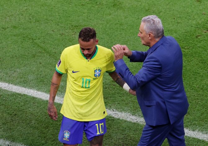 Neymar gets a pat on the back from Brazil coach Tite after being substituted during the FIFA World Cup Group G match against Serbia, at Lusail Stadium, Lusail, Qatar, on Thursday.