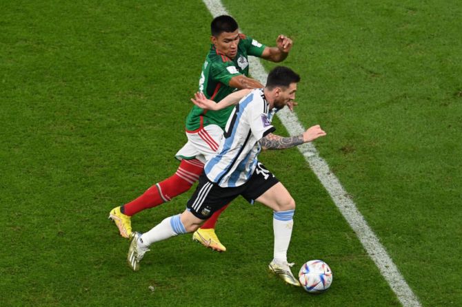 Lionel Messi of Argentina controls the ball against Jesus Gallardo of Mexico