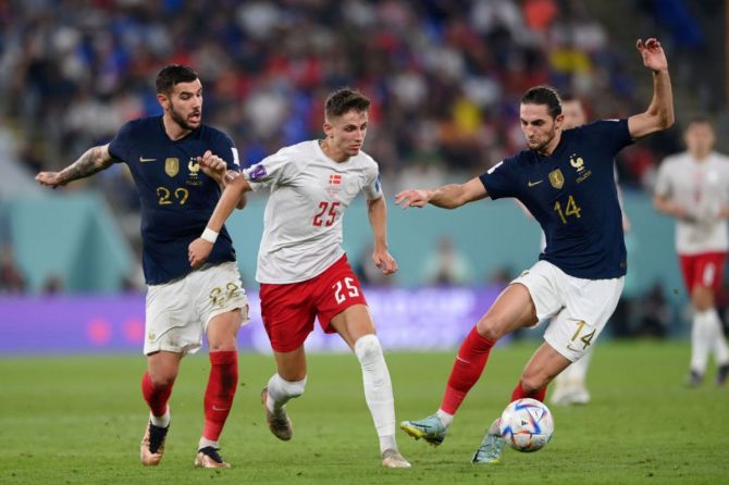 France's Adrien Rabiot controls the ball against Denmark's Jesper Lindstrom during the FIFA World Cup Qatar 2022 Group D match between France and Denmark.