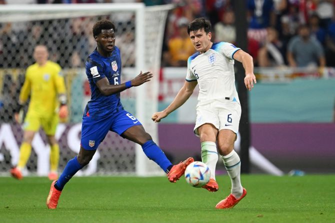 England central defender Harry Maguire controls the ball under pressure from Yunus Musah during the FIFA World Cup Group B match against the United States, at Al Bayt Stadium in Al Khor, Qatar, on Friday.