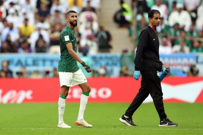 Saudi Arabia's Salman Al-Faraj walks off the pitch at halftime