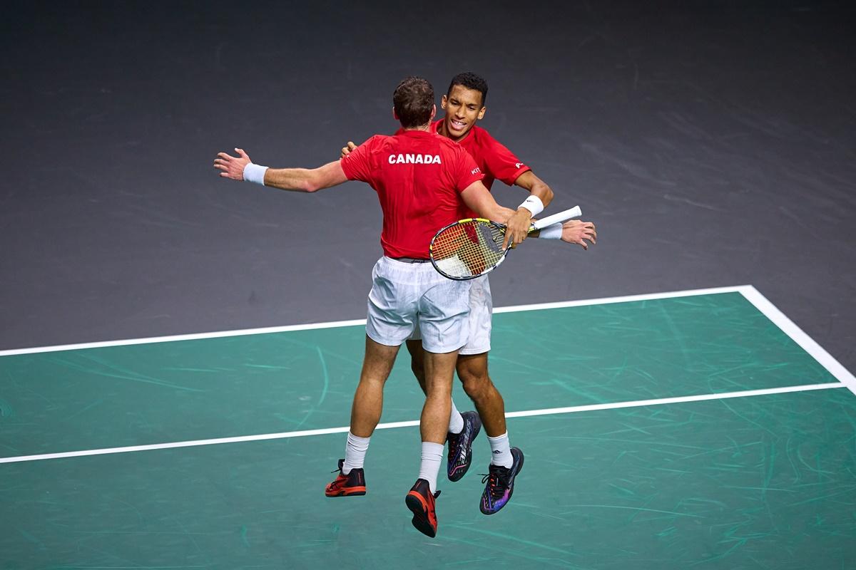 Canada's Felix Auger-Aliassime and Vasek Pospisil celebrate victory over Italians Matteo Berrettini and Fabio Fognini in the Davis semi-finals, at Palacio de los Deportes Jose Maria Martin Carpena, in Malaga, Spain, on Saturday.