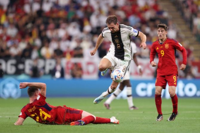 Aymeric Laporte of Spain battles for possession with Leon Goretzka of Germany