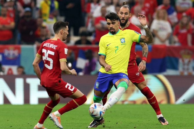 Brazil's Lucas Paqueta in action with Serbia'a Filip.