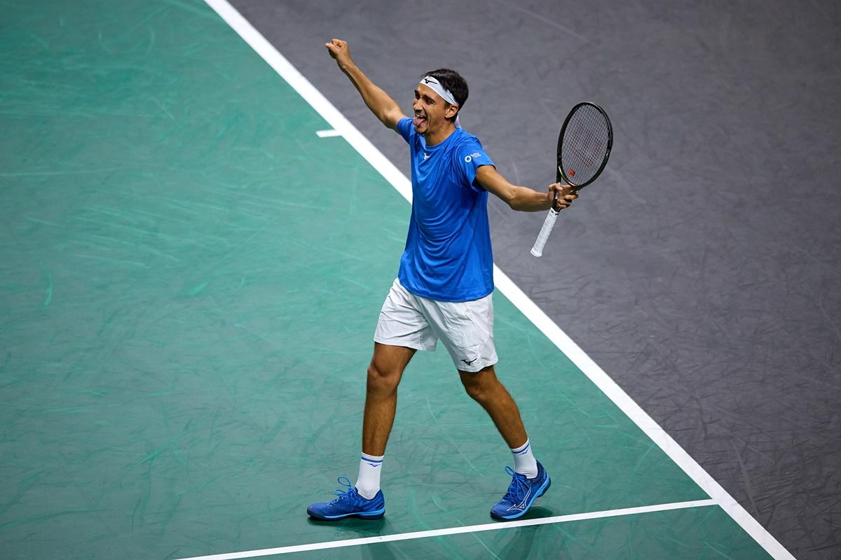 Italy's Lorenzo Sonego celebrates beating Canada's Denis Shapovalov.