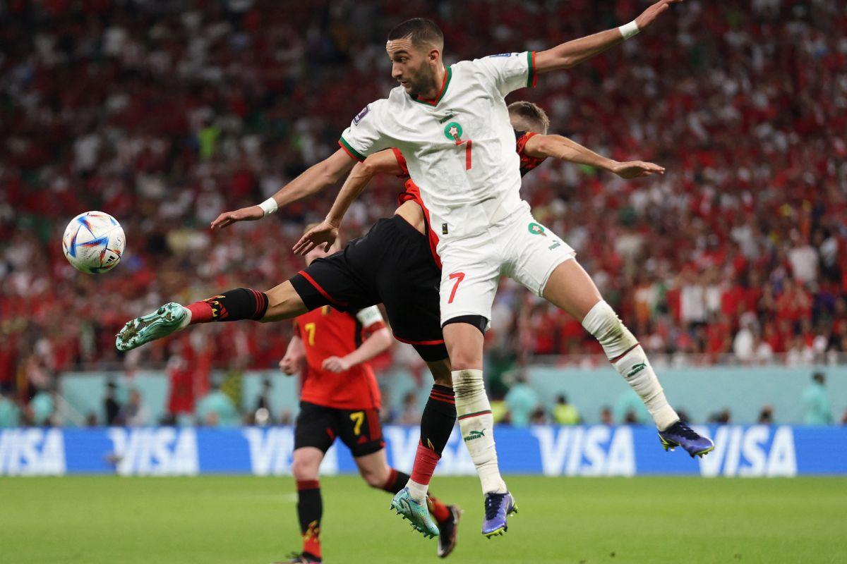 Belgium's Kevin De Bruyne in action with Morocco's Hakim Ziyech 