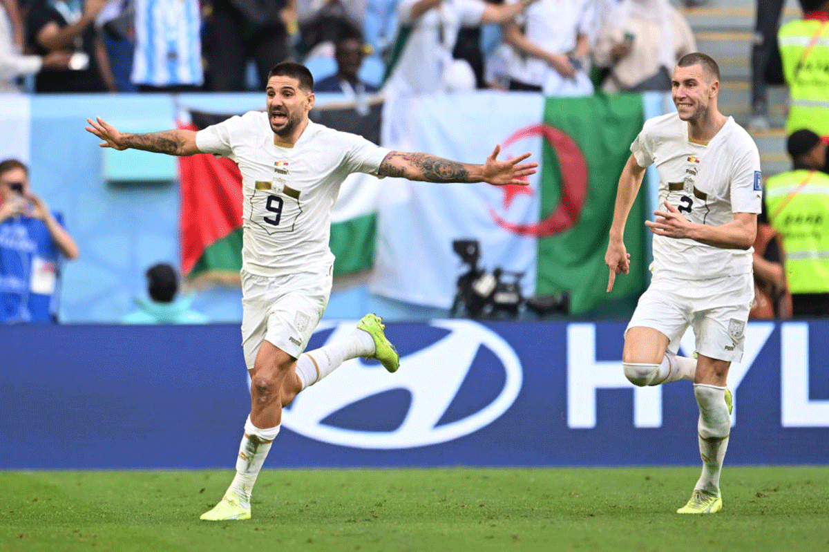 Serbia's Aleksandar Mitrovic (left) celebrates with teammate Strahinja Pavlovic (right) after scoring their team's third goal