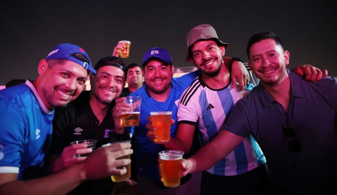Fans drink beer during Day 2 of the FIFA World Cup 2022 Qatar Fan Festival at Al Bidda Park in Doha, Qatar. 